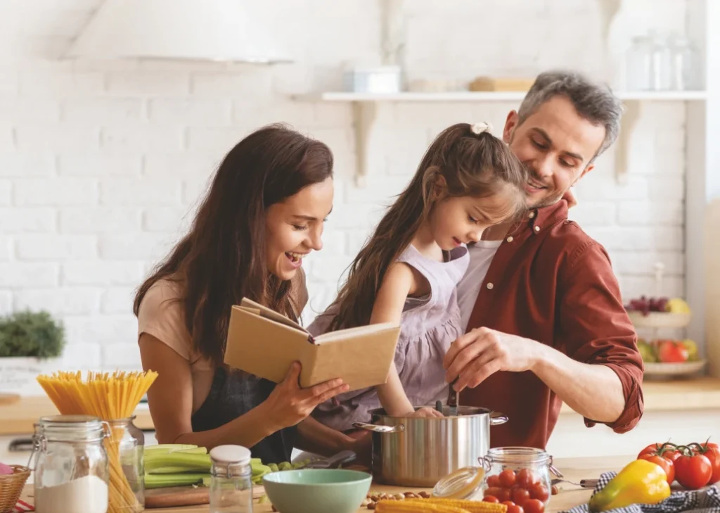 Happy cooking family in the kitchen