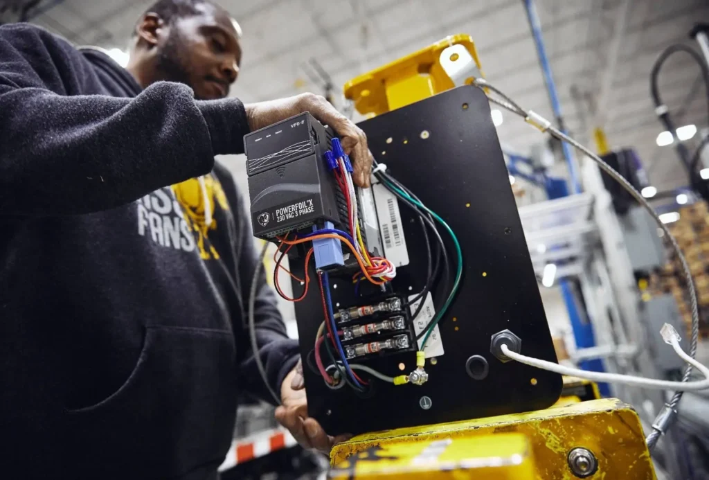 A man holding an electrical device