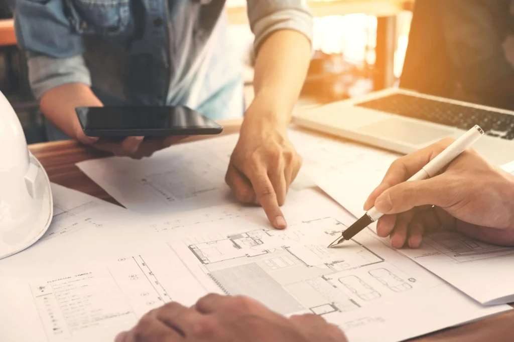 Two people at a desk with projects