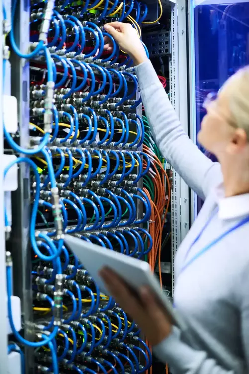 A woman next to the control panel