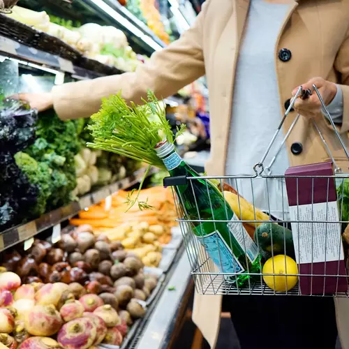 Woman with shopping cart in hand